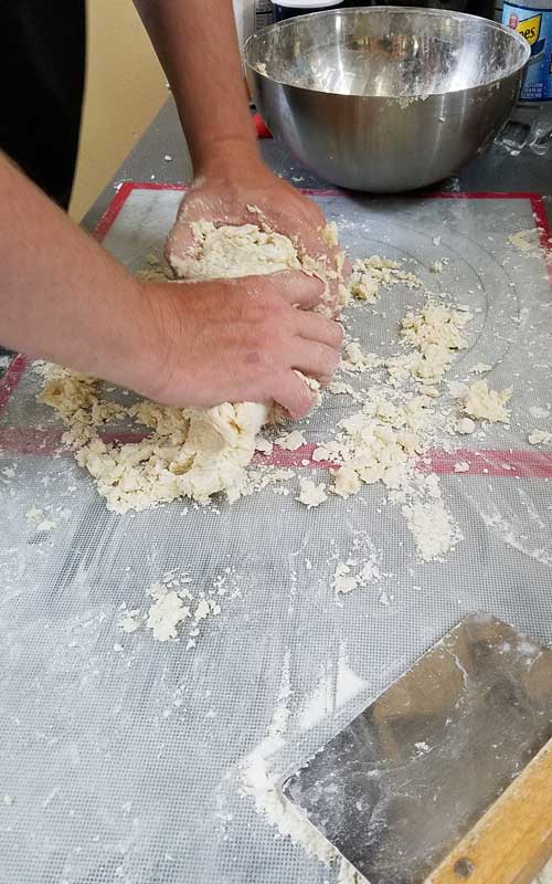 Kneading potato dough.
