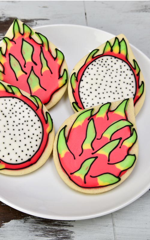 Decorated dragon fruit sugar cookies with royal icing.
