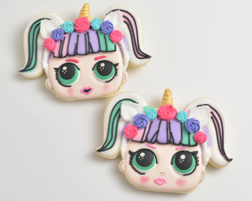 Unicorn doll cookies decorated with royal icing.