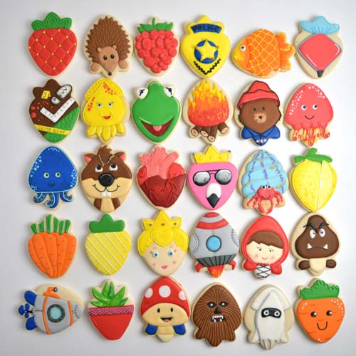 Variety of colorful 30 decorated cookies displayed on white background.