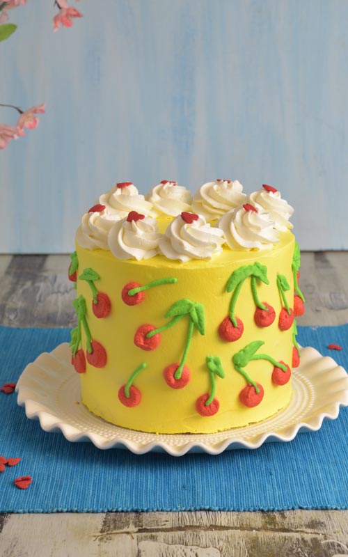Cake decorated with cherry pattern.