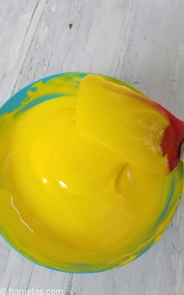 Mixing stiff icing into thin royal icing.