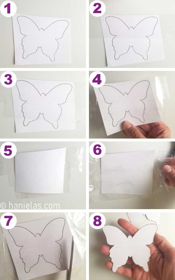 Piece of cardstock with a butterfly outline on a table.