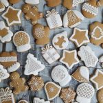 Honey cookies decorated with white icing, displayed on a kitchen counter.