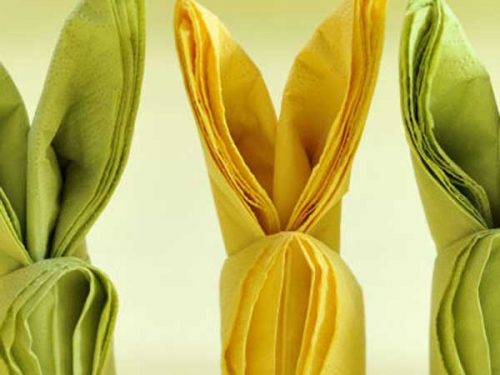 Folded yellow and green napkins into bunnies.
