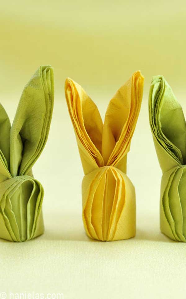 Folded yellow and green napkins into bunnies.