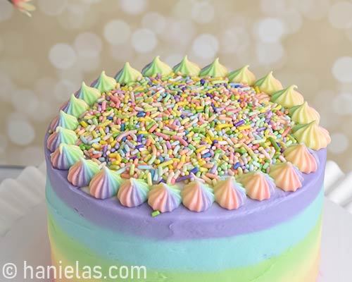 Top of the cake decorated with rainbow sprinkles.