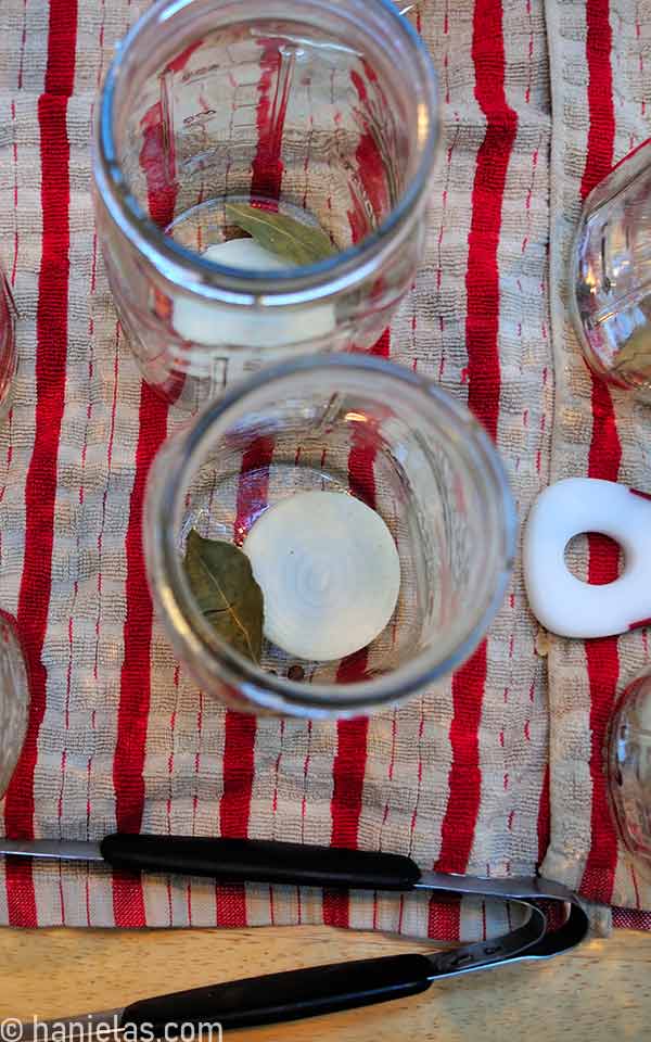 Glass jars with seasonings on the bottom.