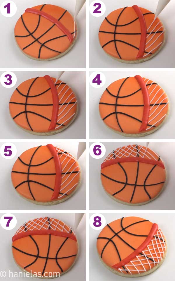 Piping white netting bellow the red hoop, on a round basketball cookie.
