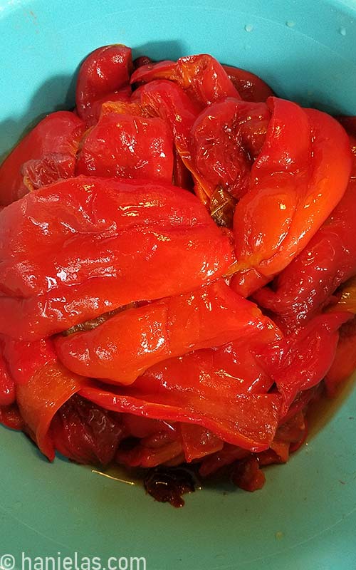 Peeled roasted peppers in a bowl.