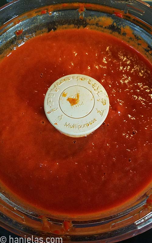 Red pepper puree in a food processor.