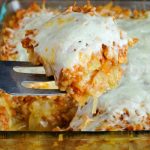 Slice of stuffed cabbage casserole on a metal spatula.