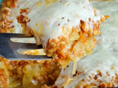 Slice of stuffed cabbage casserole on a metal spatula.