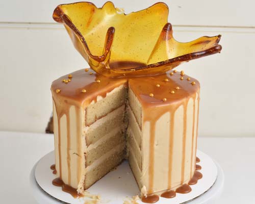 Cut cake on a cake stand.