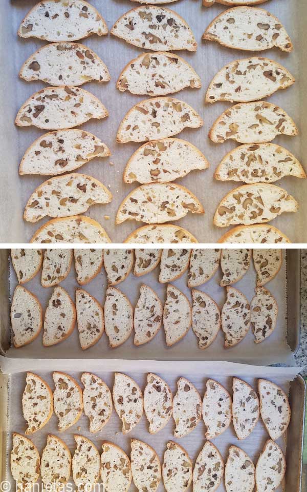 Sliced cookies on a baking sheet lined with parchment.