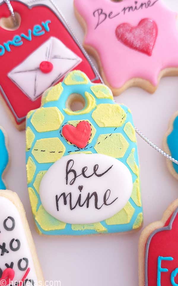 Close-up of a cookie decorated with a honeycomb pattern.