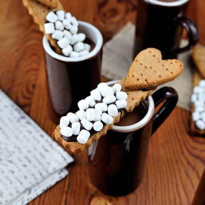 Cookie sticks dipped into hot cocoa.