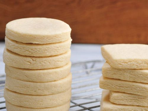 Baked cut out cookies on a cooling rack.