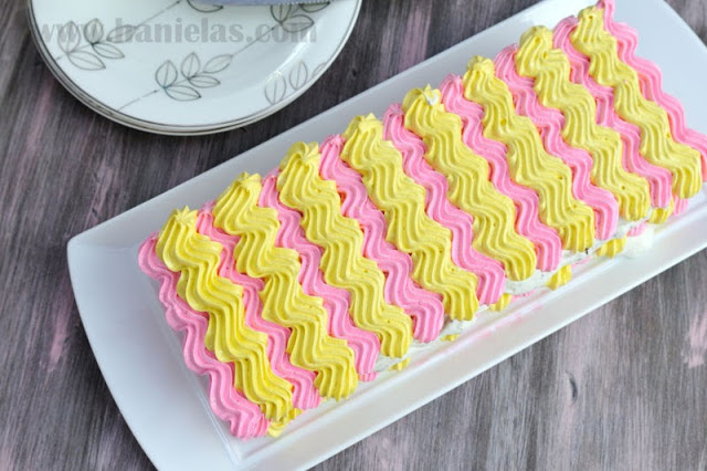 Meringue Chevron Cake with Creamy Filling and Fresh Raspberries