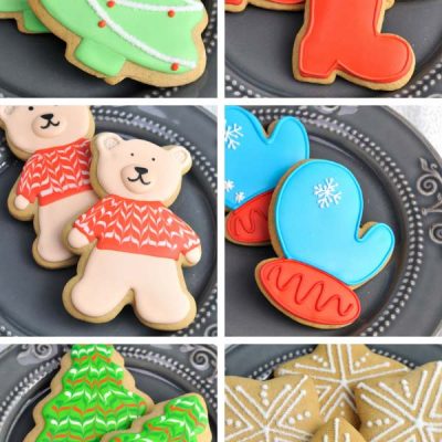 Decorated Christmas Cookies on a gray plate.