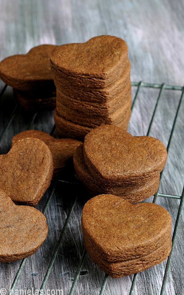 Baked cut out cookies on a cooling rack.