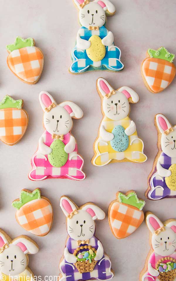 Easter bunny and carrot cookies on a counter.