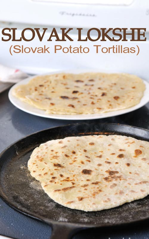 Cooked potato tortilla in a cast iron pan.