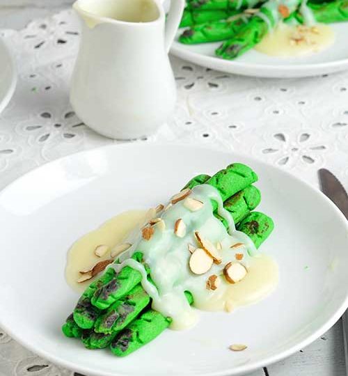 Cookies plated on a plate, drizzled with chocolate ganache.