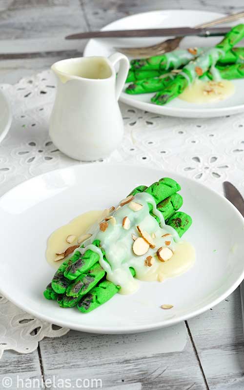 Cookies plated on a plate, drizzled with chocolate ganache.