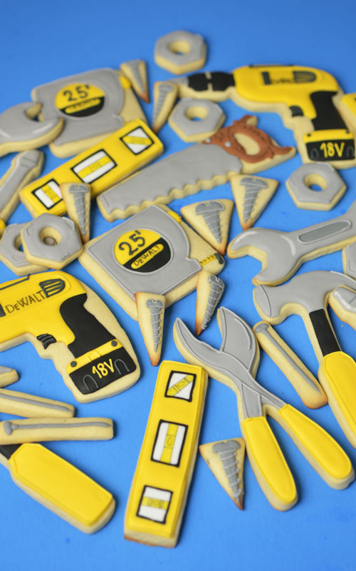 Handyman decorated cookies on blue background.