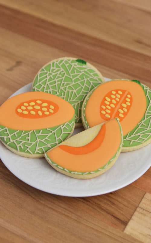 Sugar Cookies decorated like Cantaloupe Cookies on a plate.