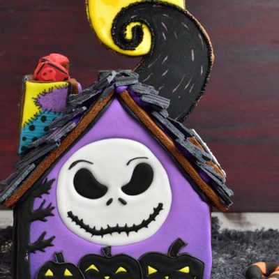 Decorated Nightmare before christmas gingerbread house on a table.