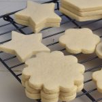 Flower cookies on a drying rack.