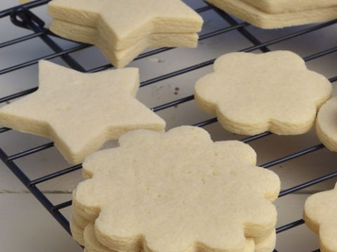 Flower cookies on a drying rack.