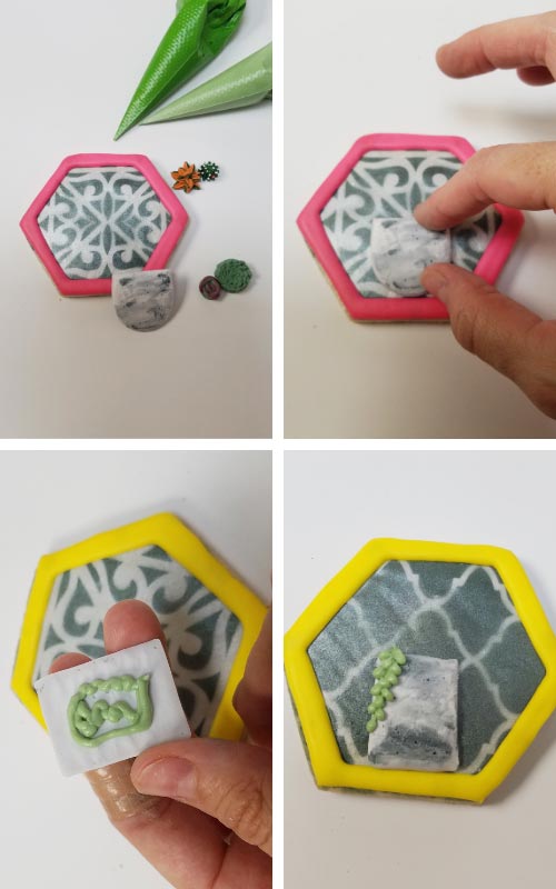 Decorating cookie with royal icing pot and piped succulents.