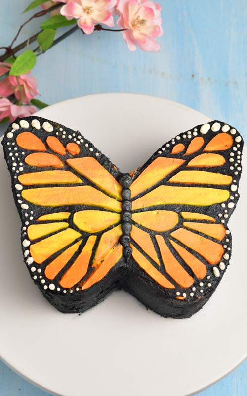 monarch butterfly cake on a cake stand