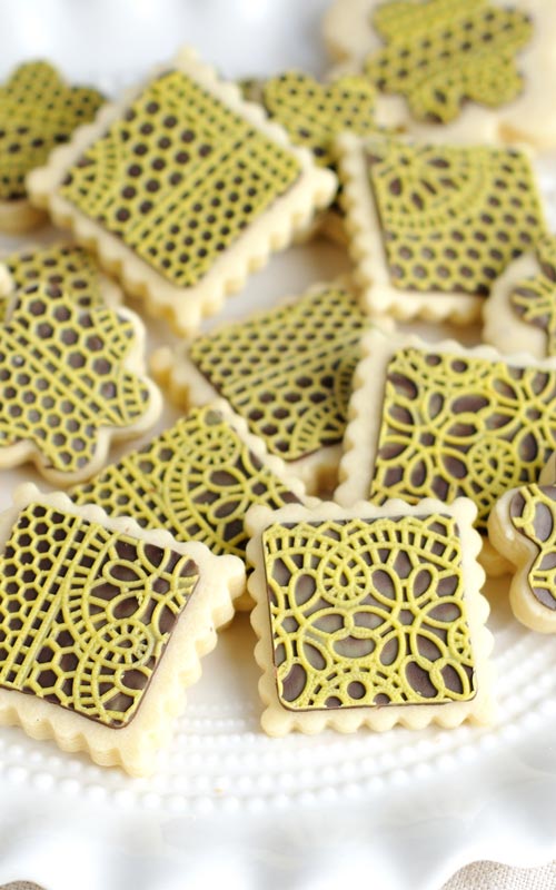 square cookies decorated with chocolate lace