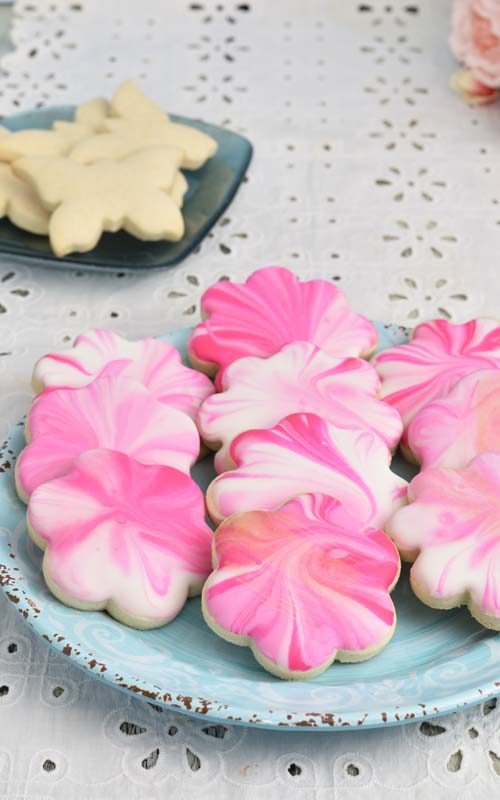 pink marbled gluten free sugar cookies on a plate