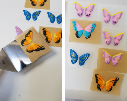 Transferring royal icing butterflies with a spatula.