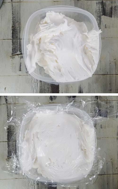 Royal icing in a container covered with a plastic wrap.