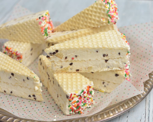 Wafer ice cream sandwiches on a plate.