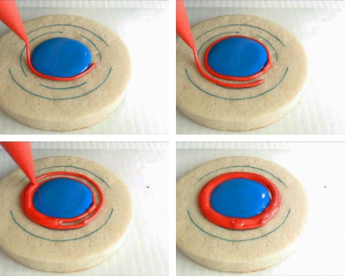Piping red ring with royal icing.