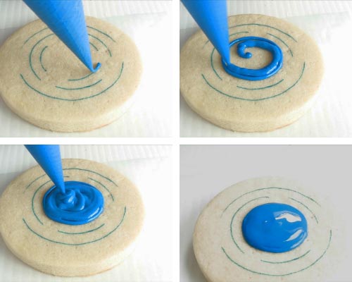 Piping a circle with blue royal icing.