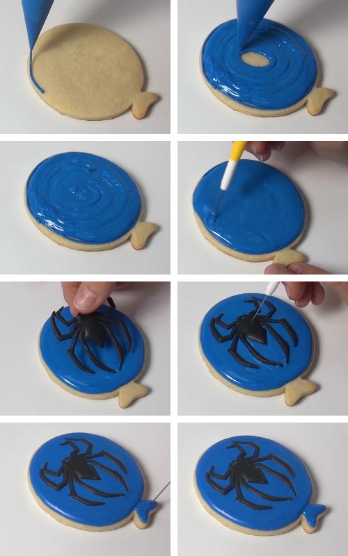 Attaching royal icing spider on a cookie iced with blue icing.