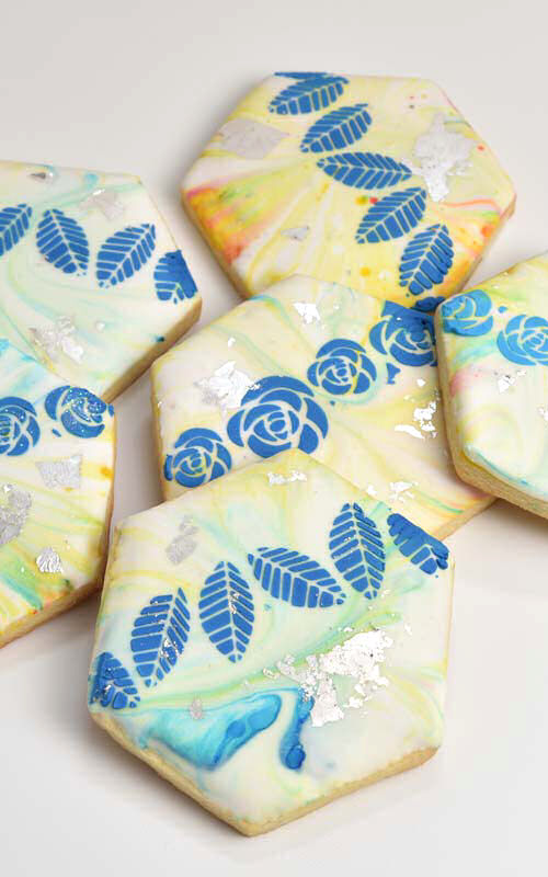 Decorated marbled sugar cookies on a table.