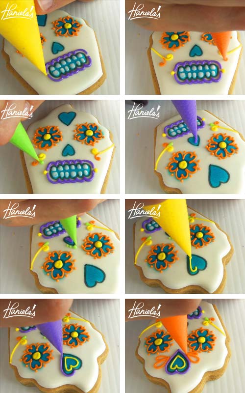 Piping nose, swirls and hearts with royal icing on a cupcake cookie.