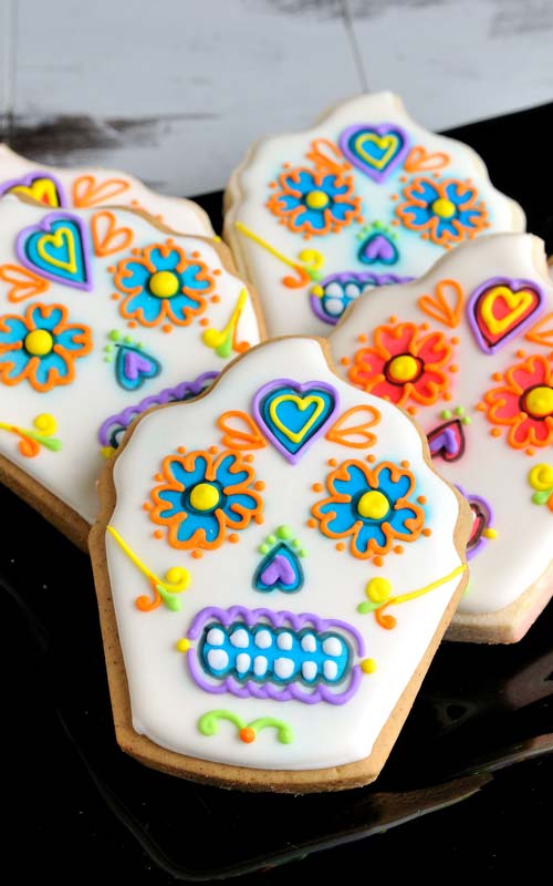 Decorated cupcake cookies that look like skulls.