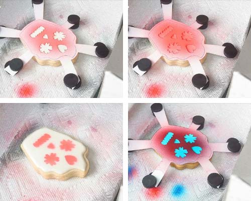 Airbrushing cookie with card stock template.
