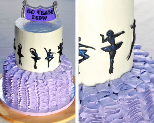 Black ballerina royal icing silhouettes on a cake.
