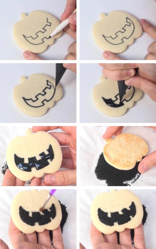 Decorating jack o lantern mouth with black royal icing and black sanding sugar.